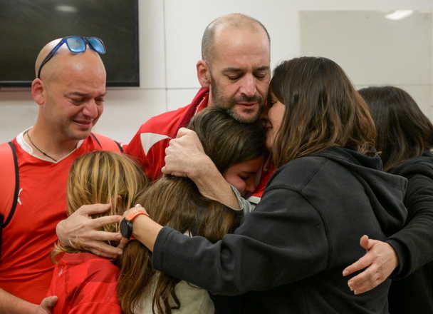Former hostages embracing