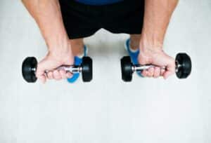 Person holding dumbbells