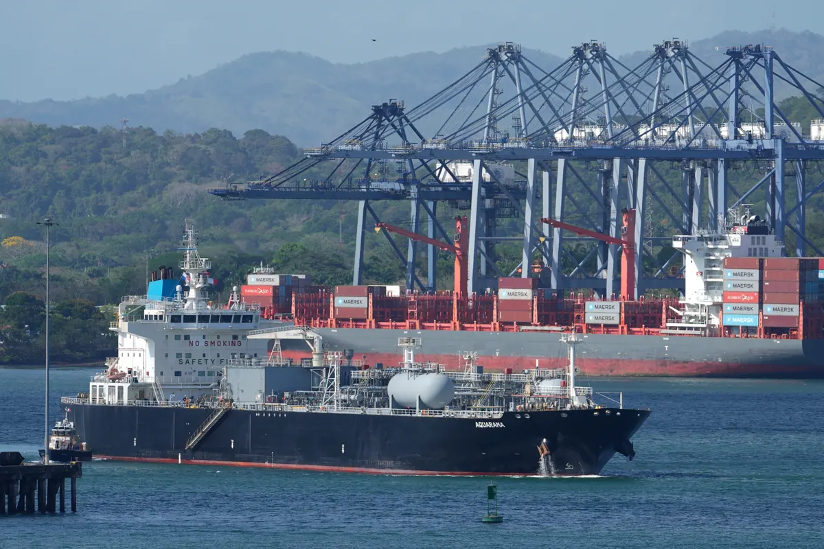 Cargo ships passing through the Panama Canal as global shipping routes adjust to rising fuel prices