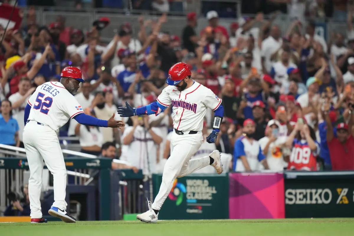 Austin Wells celebrates after hitting a game-ending home run for the Dominican Republic in the World Baseball Classic