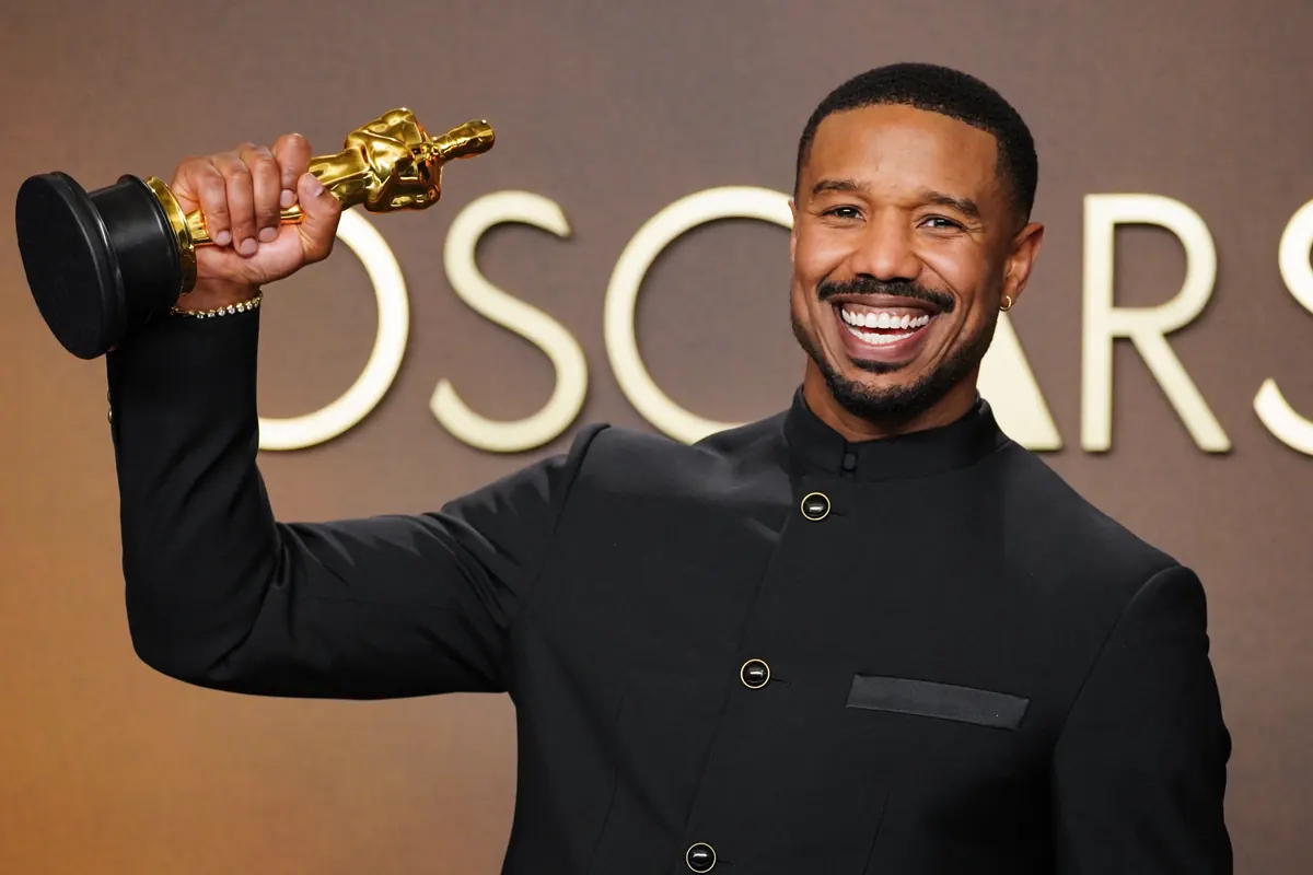 Michael B. Jordan holding his Oscar award at the Dolby Theatre in Los Angeles