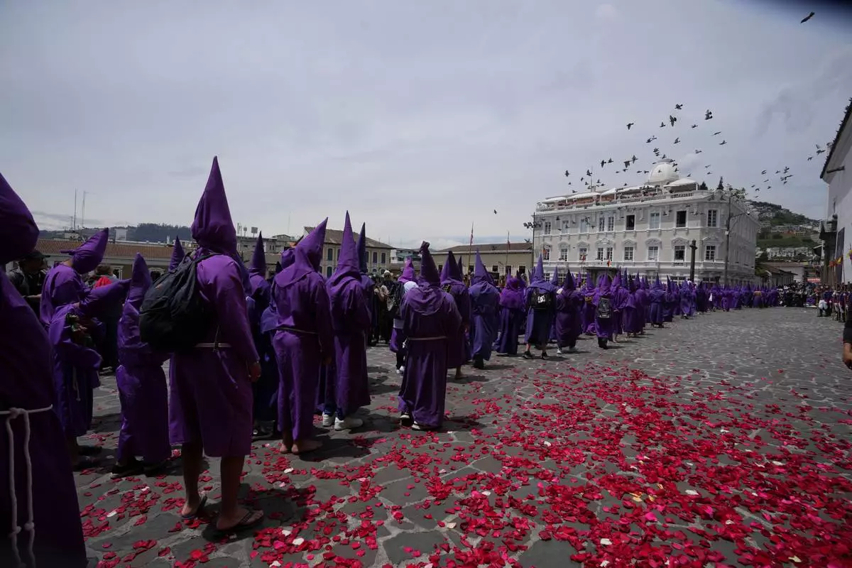 Catholic devotees carrying religious statues during Good Friday procession in Latin America