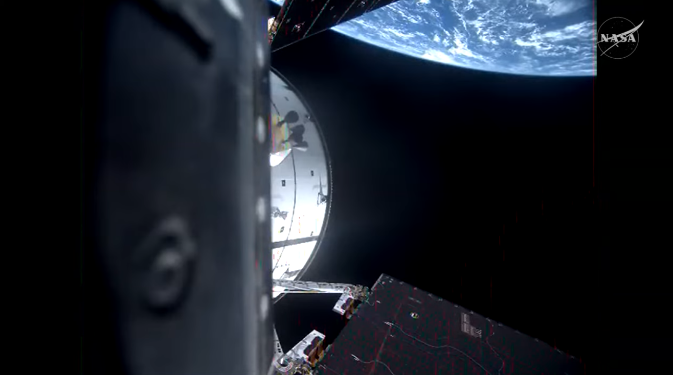 Artemis II Orion spacecraft near the Moon with Earth in background