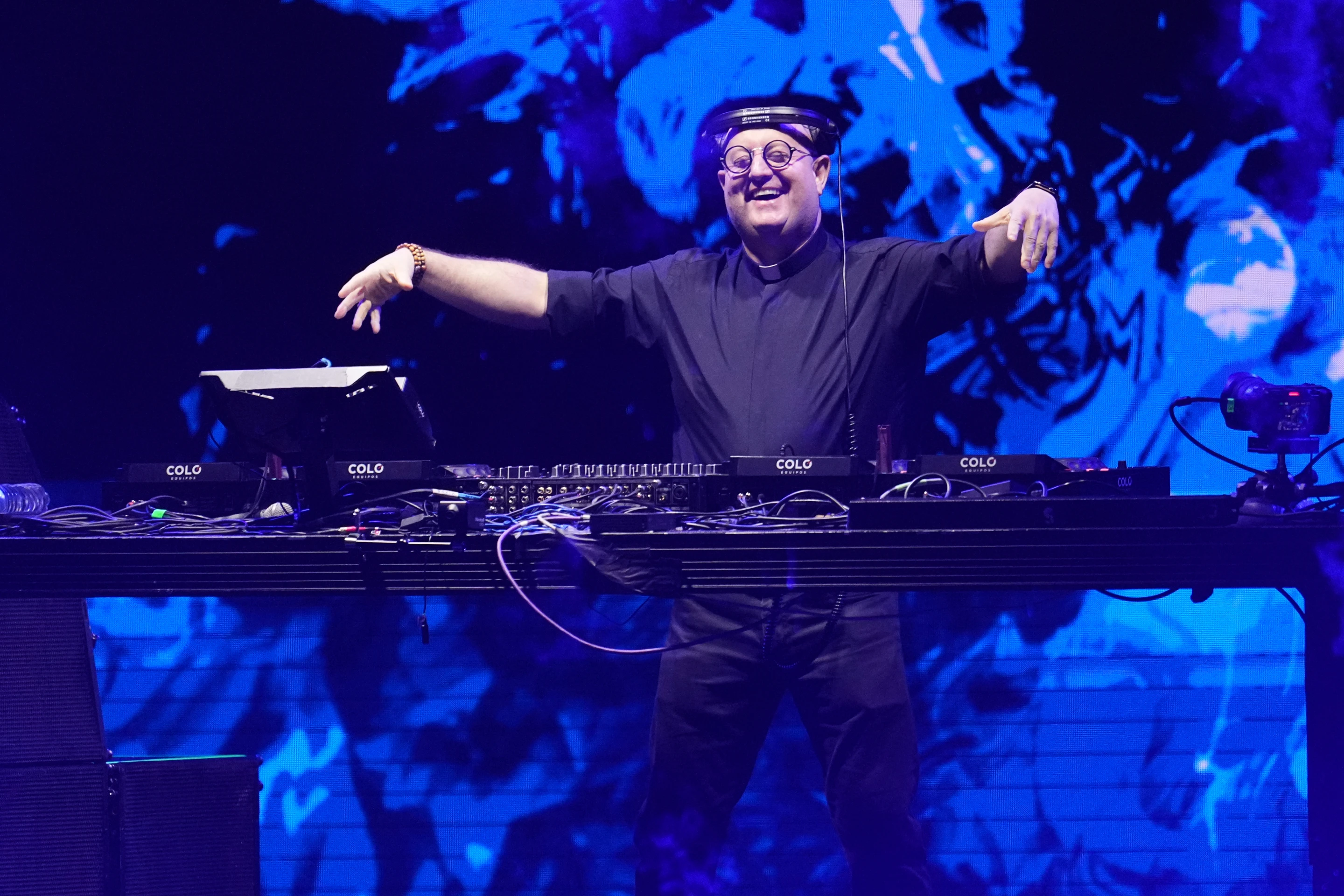 DJ priest performing at Plaza de Mayo with Pope Francis tribute visuals